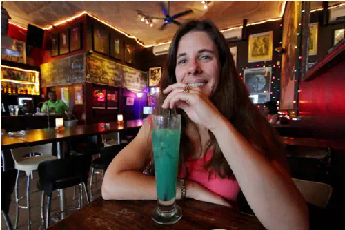 Heather drinking a cocktail at Ratz