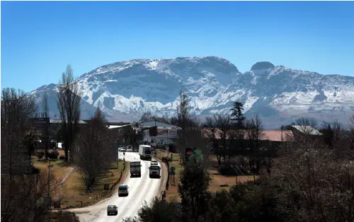 Kokstad with snow-capped mountains