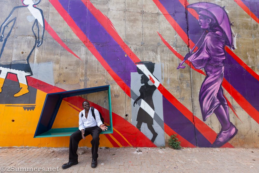 Guy on bench in S-bend mural