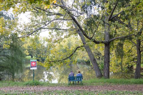 Couple sitting on a bench in Delta Park during the COVID-19 response in Joburg