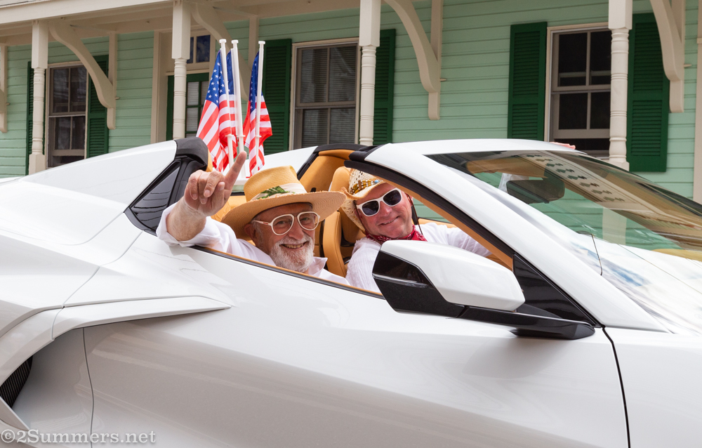 People in white car with white glasses
