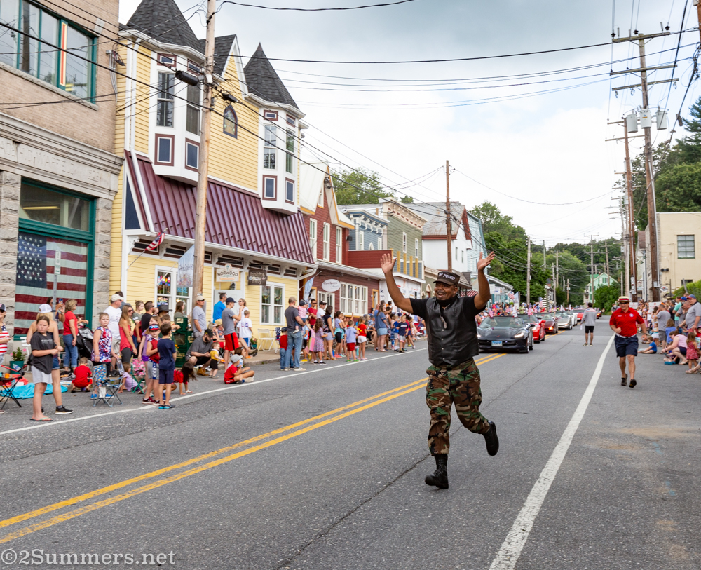 Sargent pushup runs down Main Street in the parade