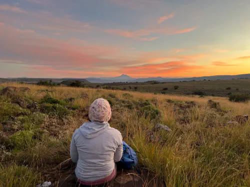 Heather watching sunrise in the Great Karoo on her Inventure.