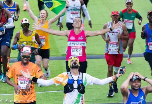 Comrades Marathon runners cross the finish line.